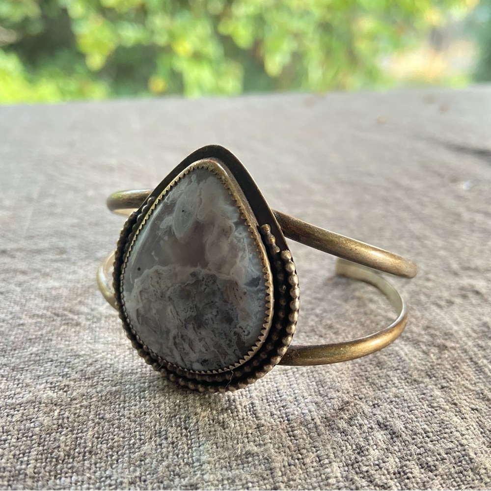 Handmade artisan silver cuff with large light blue teardrop gemstone